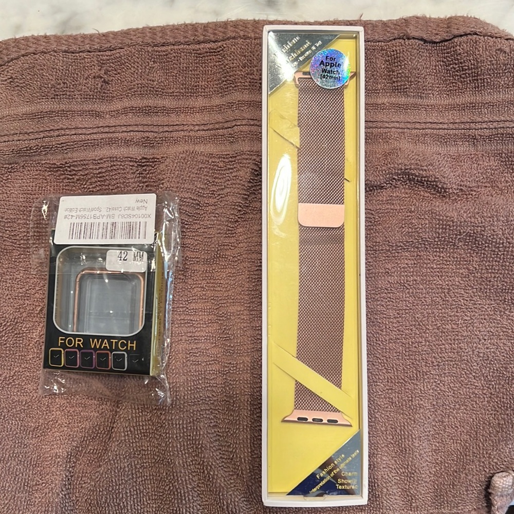 Watch Band for Apple Watch in a size 42. Rose Gold band with face case.